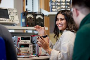 Electronic Engineering Students working with electronic equipment in a lab