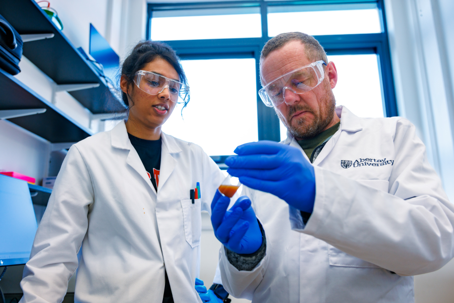 Prof Chris Gwenin and student Jessica Mahajan in the science labs at Abertay University, Dundee.